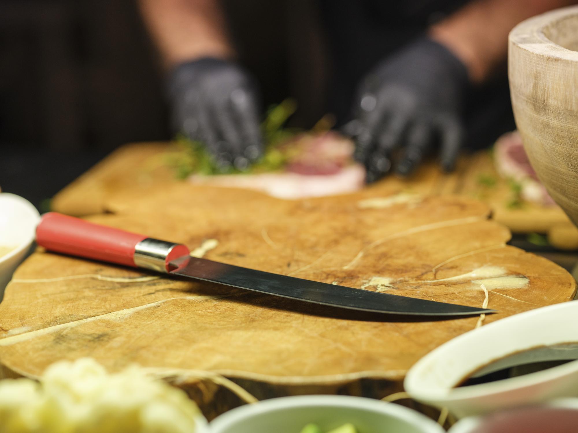 Close-up of knife skills on cutting board